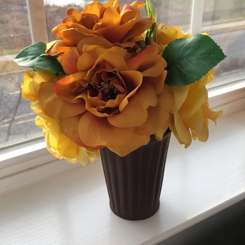 Pier 1 faux vase of flowers. 10” tall. Brown, orange, gold colors. New condition